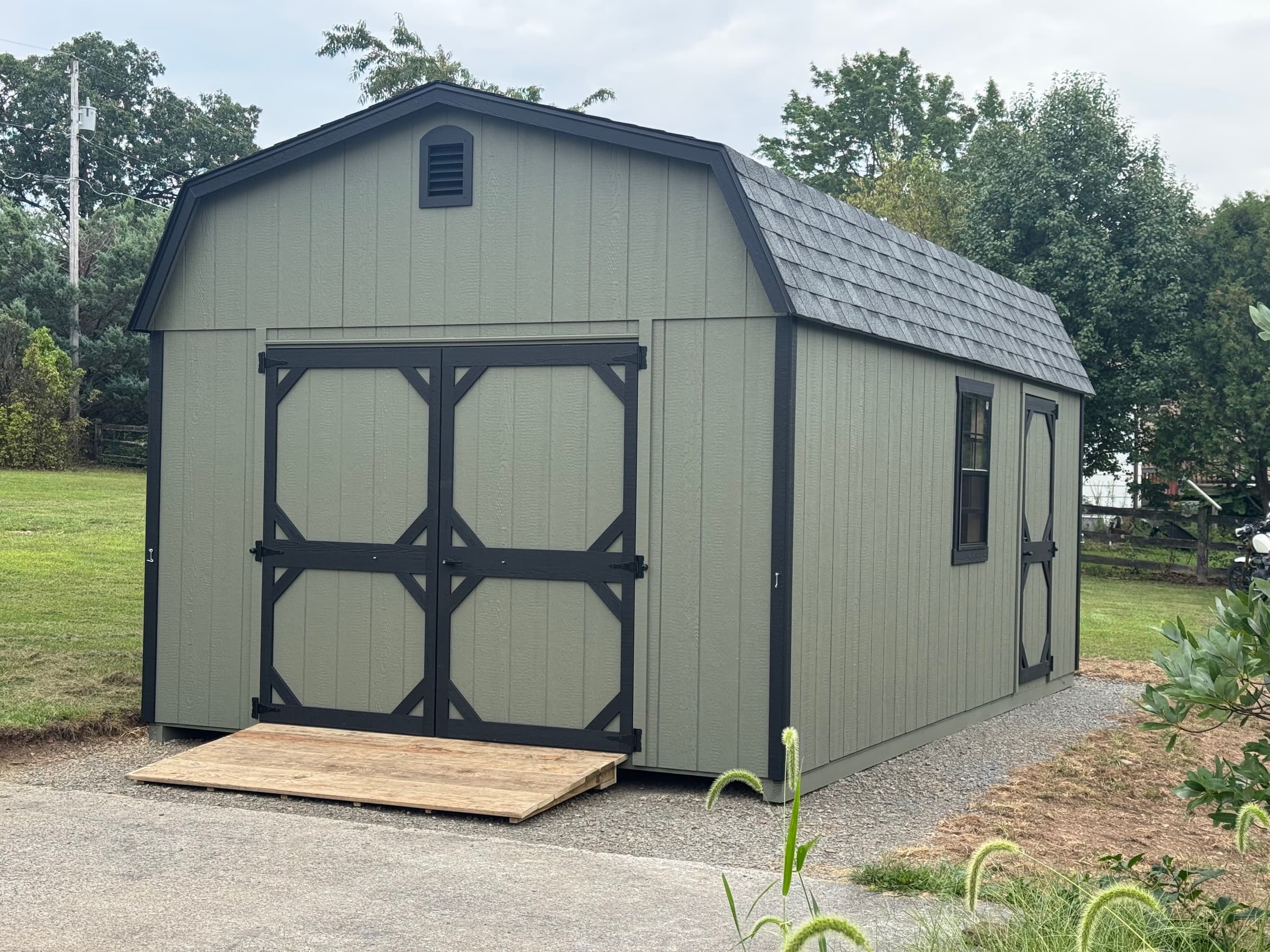 A Sage Barn Shed Built for Sawdust and Motorcycles in Winchester